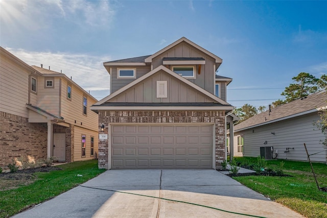 10256 Badger Run Ln, Magnolia, TX 77354 - view of front of property with board and batten siding, driveway, brick siding, and central AC