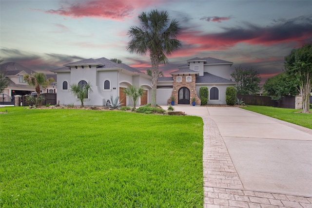 39 New Oak Trl, Humble, TX 77346 - mediterranean / spanish-style home with concrete driveway, stucco siding, and roof with shingles