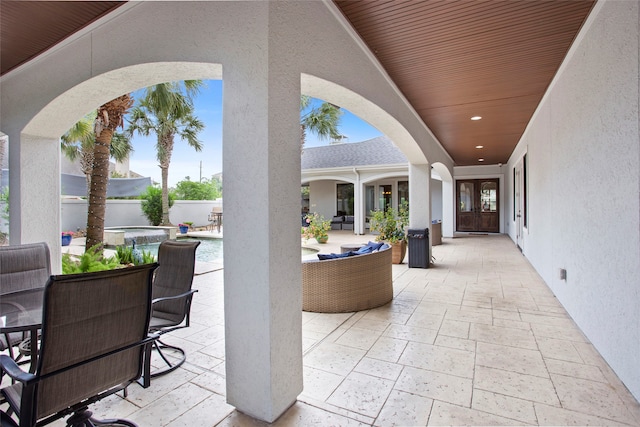 39 New Oak Trl, Humble, TX 77346 - view of patio featuring french doors, a pool with connected hot tub, and fence