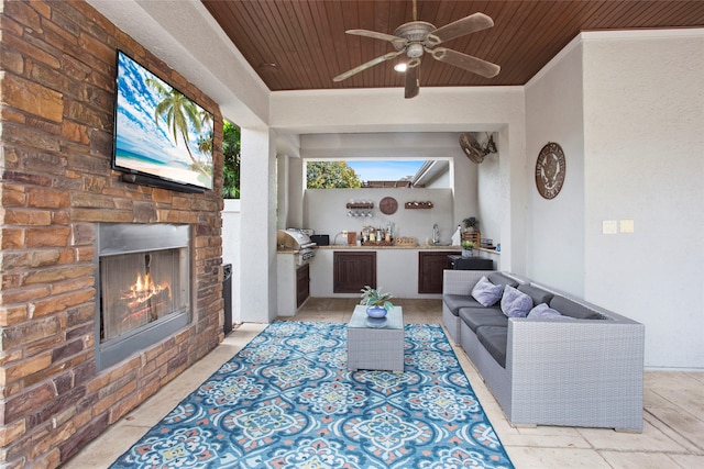 39 New Oak Trl, Humble, TX 77346 - living area with wooden ceiling, a ceiling fan, and a lit fireplace