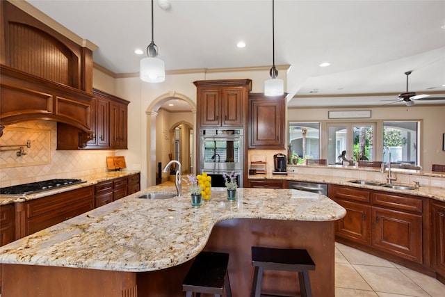 39 New Oak Trl, Humble, TX 77346 - kitchen with a sink, stainless steel appliances, tasteful backsplash, a ceiling fan, and recessed lighting
