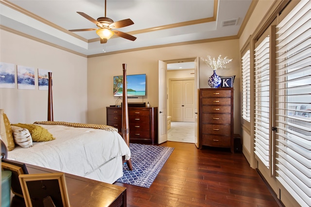 39 New Oak Trl, Humble, TX 77346 - bedroom with a raised ceiling, ornamental molding, dark wood-type flooring, and a ceiling fan