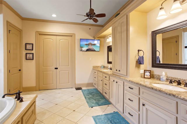 39 New Oak Trl, Humble, TX 77346 - full bath featuring double vanity, a ceiling fan, tile patterned flooring, a bath, and baseboards