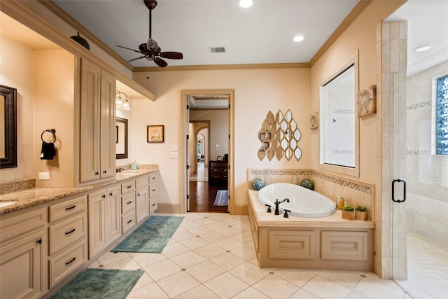 39 New Oak Trl, Humble, TX 77346 - bathroom with double vanity, a bath, a shower stall, a ceiling fan, and ornamental molding