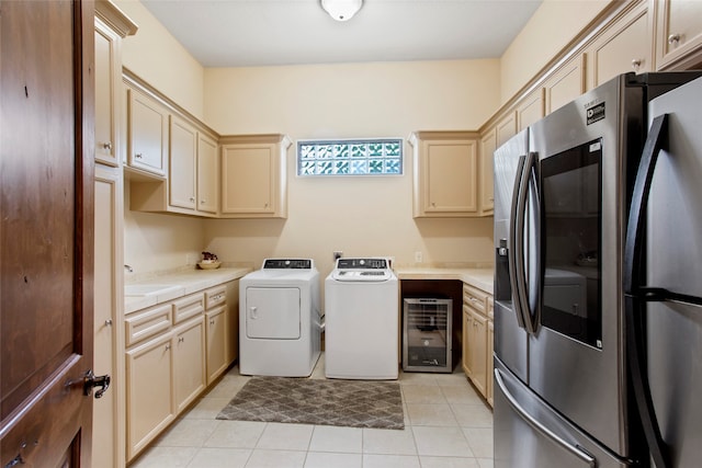 39 New Oak Trl, Humble, TX 77346 - washroom featuring washing machine and clothes dryer, beverage cooler, and light tile patterned floors