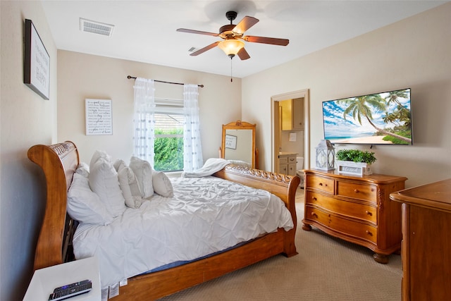 39 New Oak Trl, Humble, TX 77346 - bedroom with carpet floors, a ceiling fan, and ensuite bath