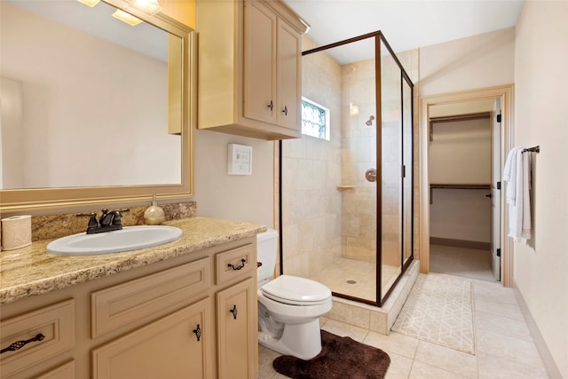 39 New Oak Trl, Humble, TX 77346 - bathroom with a stall shower, tile patterned floors, toilet, vanity, and baseboards