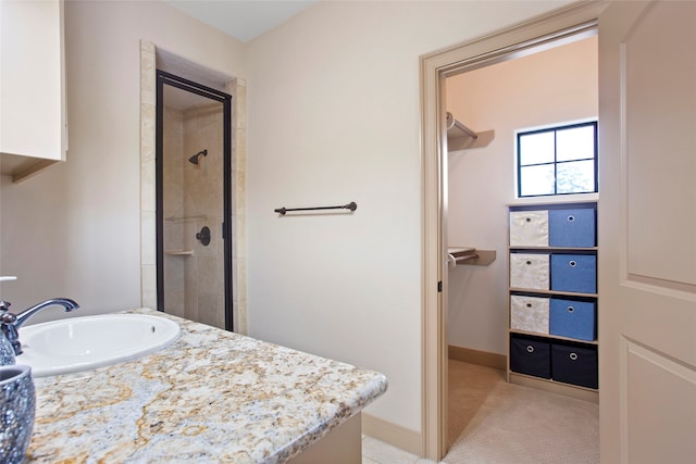 39 New Oak Trl, Humble, TX 77346 - bathroom with a sink, a shower stall, and baseboards