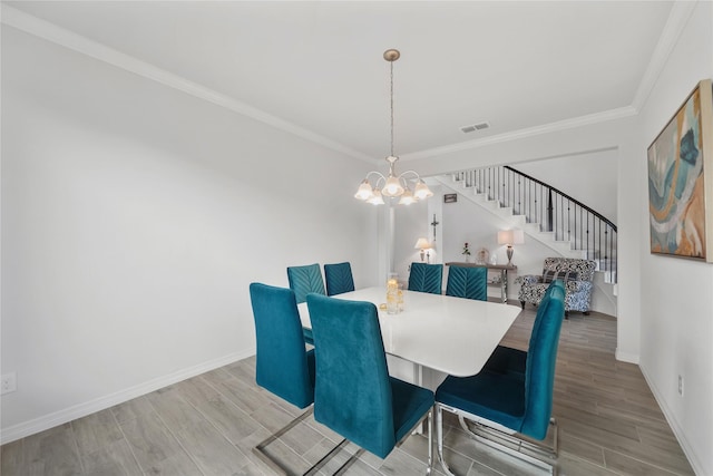 1711 Country Air Ln, Missouri City, TX 77459 - dining room with stairs, a chandelier, crown molding, baseboards, and wood finished floors