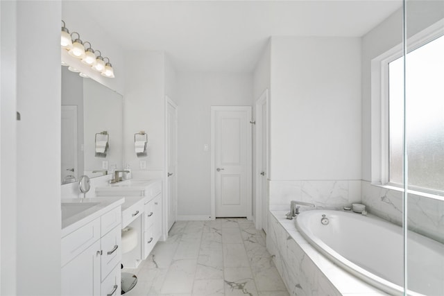 1711 Country Air Ln, Missouri City, TX 77459 - bathroom with marble look tile flooring, a bath, double vanity, and baseboards