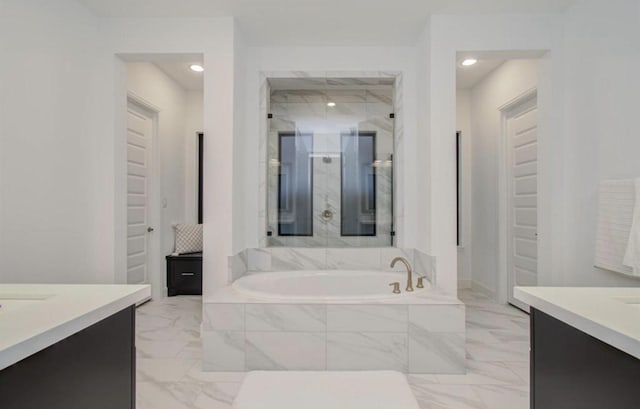 8911 Orchard Cv, Missouri City, TX 77459 - bathroom with marble finish floors, a stall shower, vanity, a bath, and recessed lighting