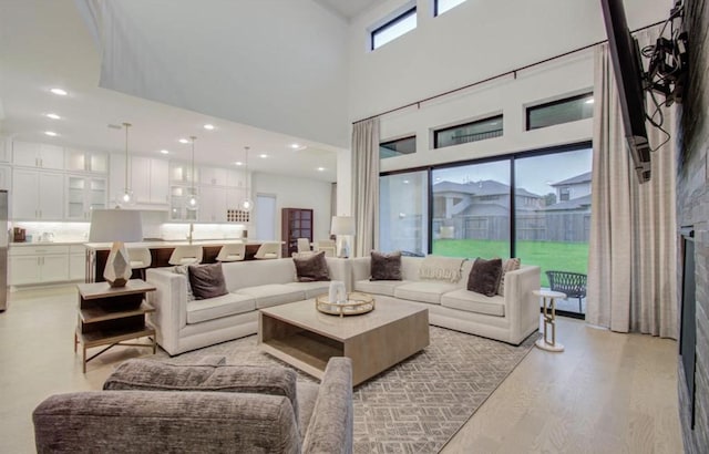 8911 Orchard Cv, Missouri City, TX 77459 - living room featuring light wood finished floors and a high ceiling