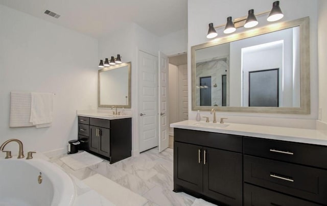 8911 Orchard Cv, Missouri City, TX 77459 - full bathroom with a shower stall, marble finish floors, two vanities, and a garden tub