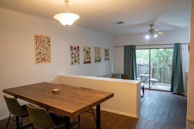 11404 Walnut Ridge Dv Unit 103, Austin, TX 78753 - dining room featuring dark wood-style flooring, a ceiling fan, and baseboards