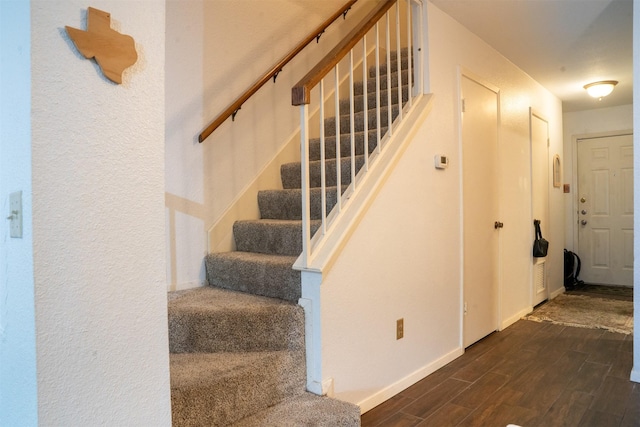 11404 Walnut Ridge Dv Unit 103, Austin, TX 78753 - staircase featuring wood finished floors and baseboards