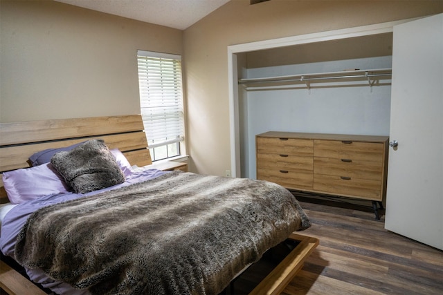11404 Walnut Ridge Dv Unit 103, Austin, TX 78753 - bedroom with dark wood-type flooring and lofted ceiling