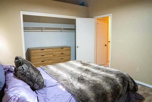 11404 Walnut Ridge Dv Unit 103, Austin, TX 78753 - bedroom featuring wood finished floors and baseboards