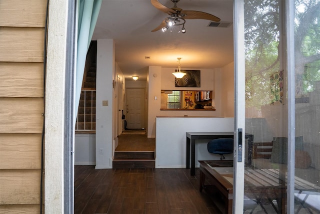 11404 Walnut Ridge Dv Unit 103, Austin, TX 78753 - hallway featuring dark wood-type flooring, stairs, and baseboards