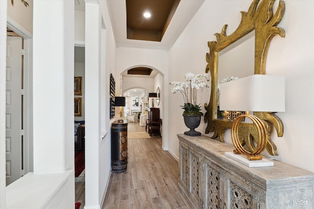 7918 Silver Grove Dr, Magnolia, TX 77354 - corridor featuring arched walkways, wood finished floors, and baseboards