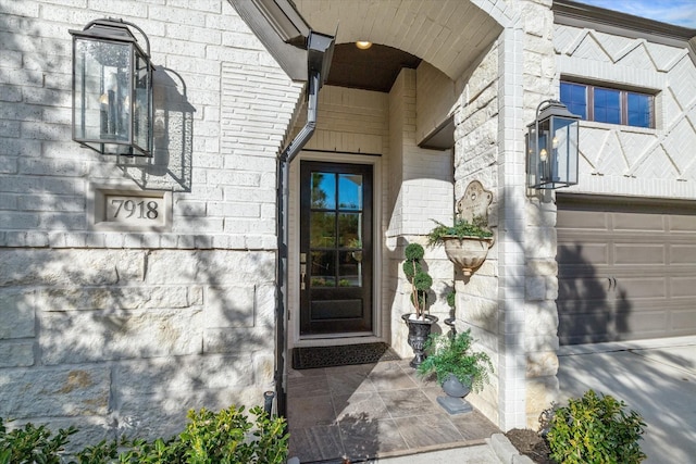 7918 Silver Grove Dr, Magnolia, TX 77354 - property entrance with stone siding and a garage