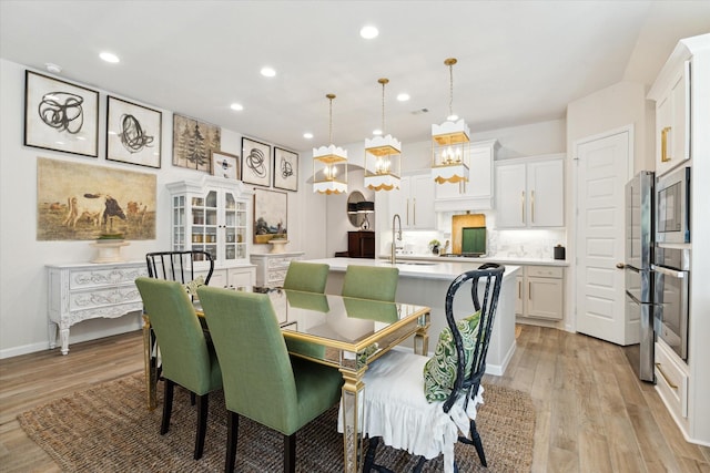 7918 Silver Grove Dr, Magnolia, TX 77354 - dining space with a chandelier, recessed lighting, and light wood-style floors