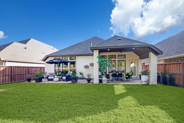 7918 Silver Grove Dr, Magnolia, TX 77354 - rear view of property featuring ceiling fan, a shingled roof, a patio, an outdoor hangout area, and brick siding