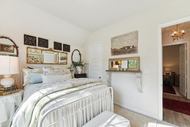 7918 Silver Grove Dr, Magnolia, TX 77354 - bedroom featuring a chandelier, baseboards, and vaulted ceiling
