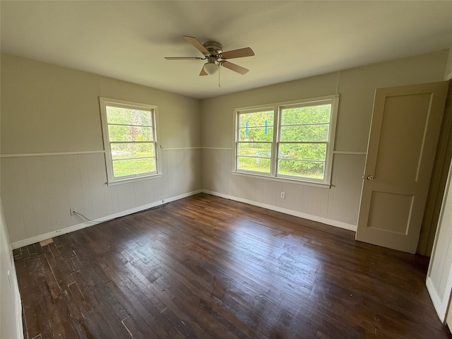 1510 Oleander Dr, La Marque, TX 77568 - unfurnished room with a ceiling fan, wood-type flooring, wainscoting, and baseboards