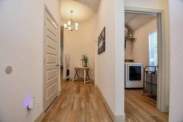 2543 Summer Peach St, Katy, TX 77494 - corridor featuring washer / dryer, a chandelier, light wood-type flooring, and baseboards