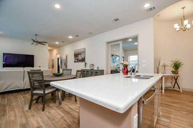 2543 Summer Peach St, Katy, TX 77494 - kitchen featuring a sink, dishwasher, light wood-type flooring, a chandelier, and recessed lighting