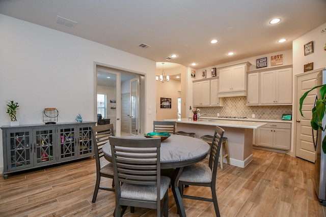 2543 Summer Peach St, Katy, TX 77494 - dining area with light wood-type flooring, recessed lighting, and a chandelier