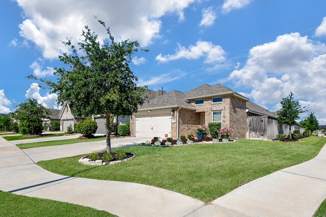 2543 Summer Peach St, Katy, TX 77494 - view of front facade with brick siding, concrete driveway, an attached garage, and roof with shingles