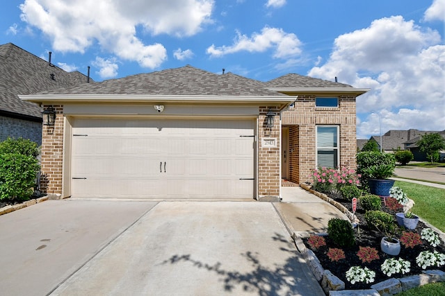 2543 Summer Peach St, Katy, TX 77494 - view of front of property featuring brick siding, driveway, a garage, and a shingled roof