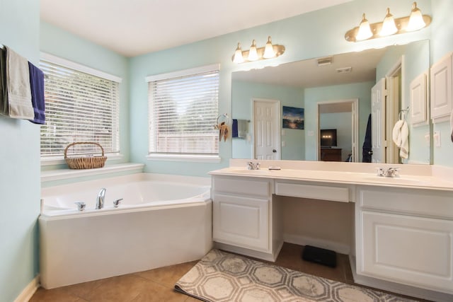 13614 Brighton Park Dr, Houston, TX 77044 - full bath featuring a garden tub, double vanity, and tile patterned flooring