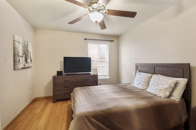 13614 Brighton Park Dr, Houston, TX 77044 - bedroom featuring wood finished floors, baseboards, and ceiling fan
