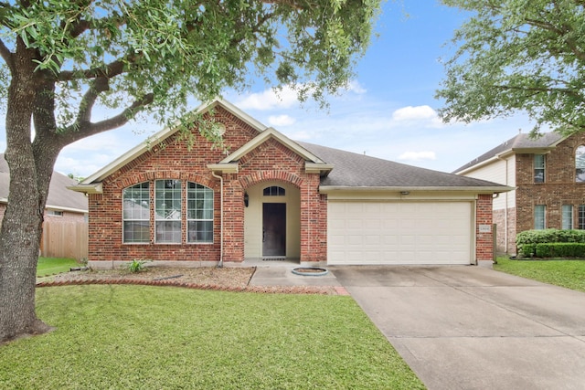 13614 Brighton Park Dr, Houston, TX 77044 - traditional home featuring brick siding, a garage, driveway, and a shingled roof