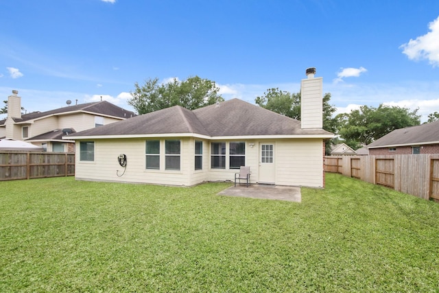 13614 Brighton Park Dr, Houston, TX 77044 - rear view of house with a chimney and a patio