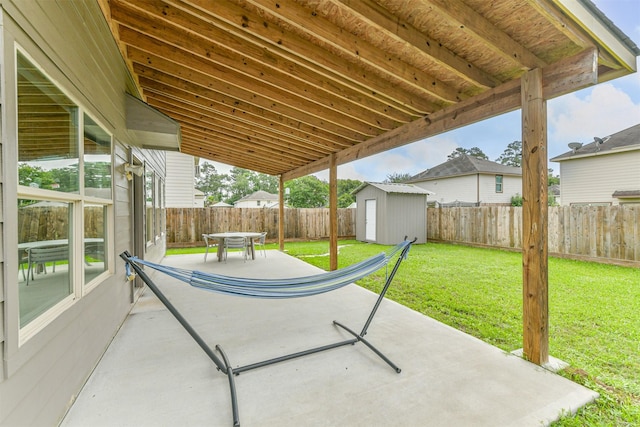 view of patio / terrace featuring a shed and an outbuilding