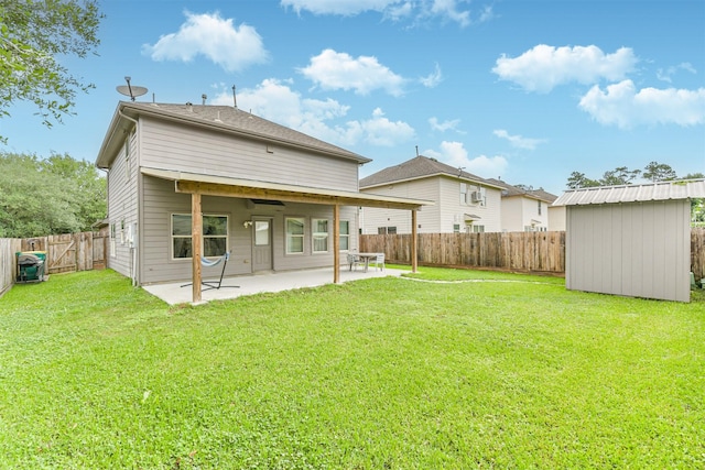 back of house with a shed, a patio area, and an outdoor structure