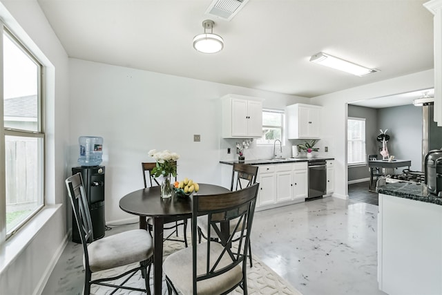 dining area with baseboards and concrete floors