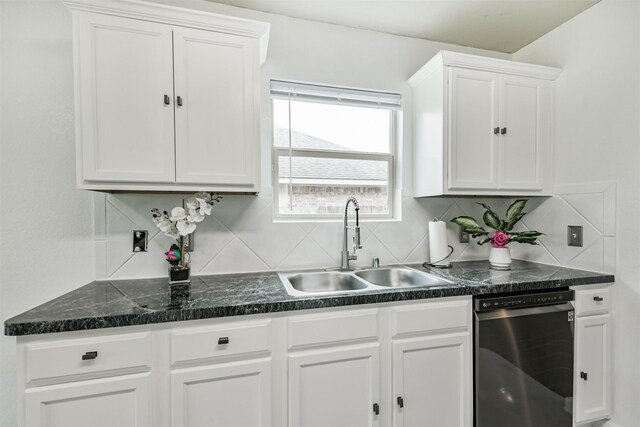 kitchen featuring dishwasher, a sink, decorative backsplash, and white cabinetry