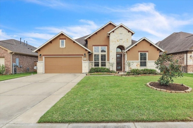 2321 Vineyard Terrace Ln, League City, TX 77573 - view of front of property featuring stone siding, stucco siding, a front lawn, driveway, and an attached garage