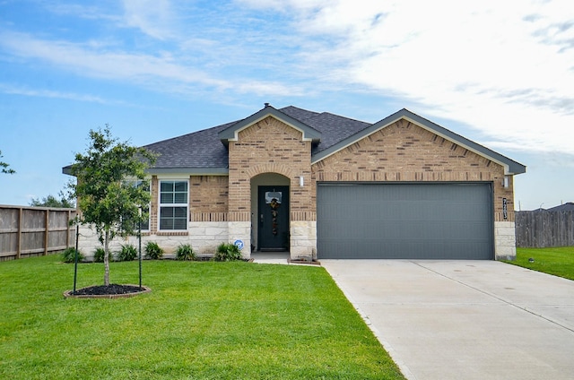 view of front facade with a shingled roof, an attached garage, driveway, brick siding, and stone siding