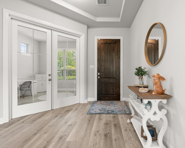 entryway featuring wood finished floors and baseboards