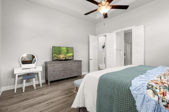 bedroom with wood finished floors, baseboards, and ceiling fan