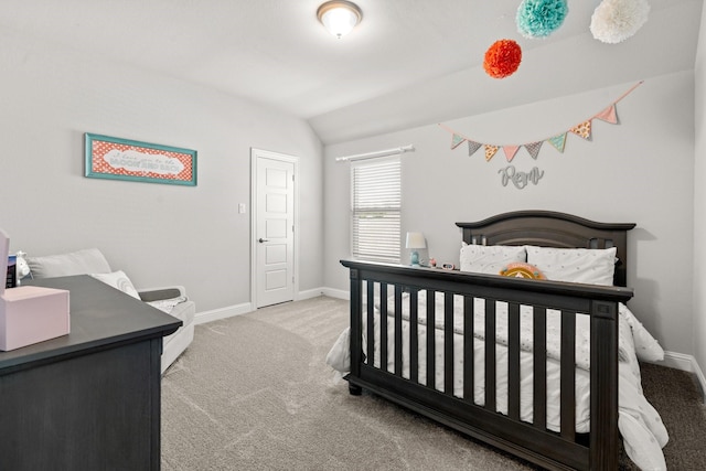 bedroom with carpet flooring, baseboards, and vaulted ceiling