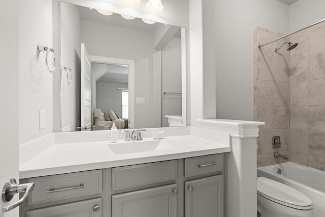full bathroom with vanity, toilet, shower / bathtub combination, and ensuite bathroom