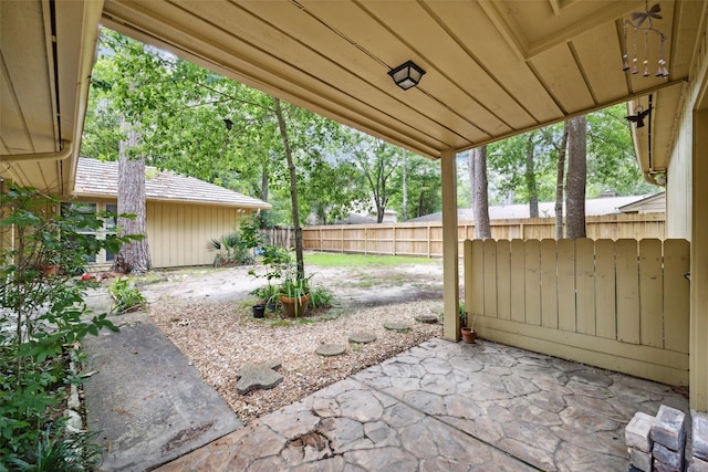 view of patio featuring fence