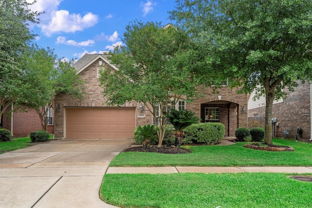 obstructed view of property featuring brick siding, a garage, driveway, and a front lawn