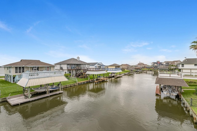 7 N Flamingo St, La Marque, TX 77568 - dock area featuring boat lift, a residential view, and a water view